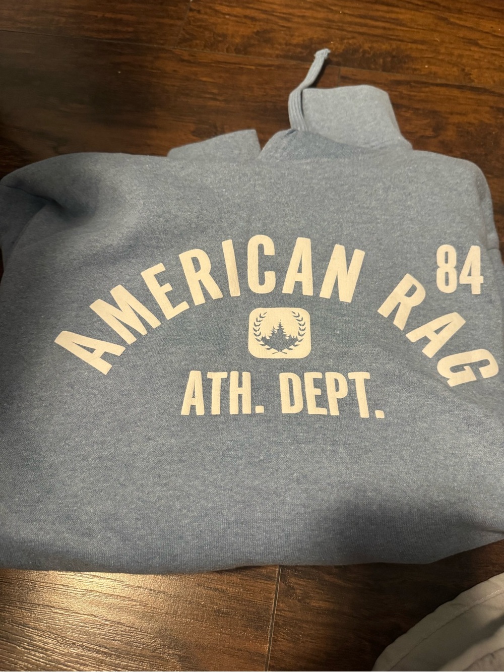 American Rag Men's Light Blue Crewneck Sweatshirt with Cream Logo